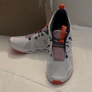 On Running White and Orange Athletic Shoes